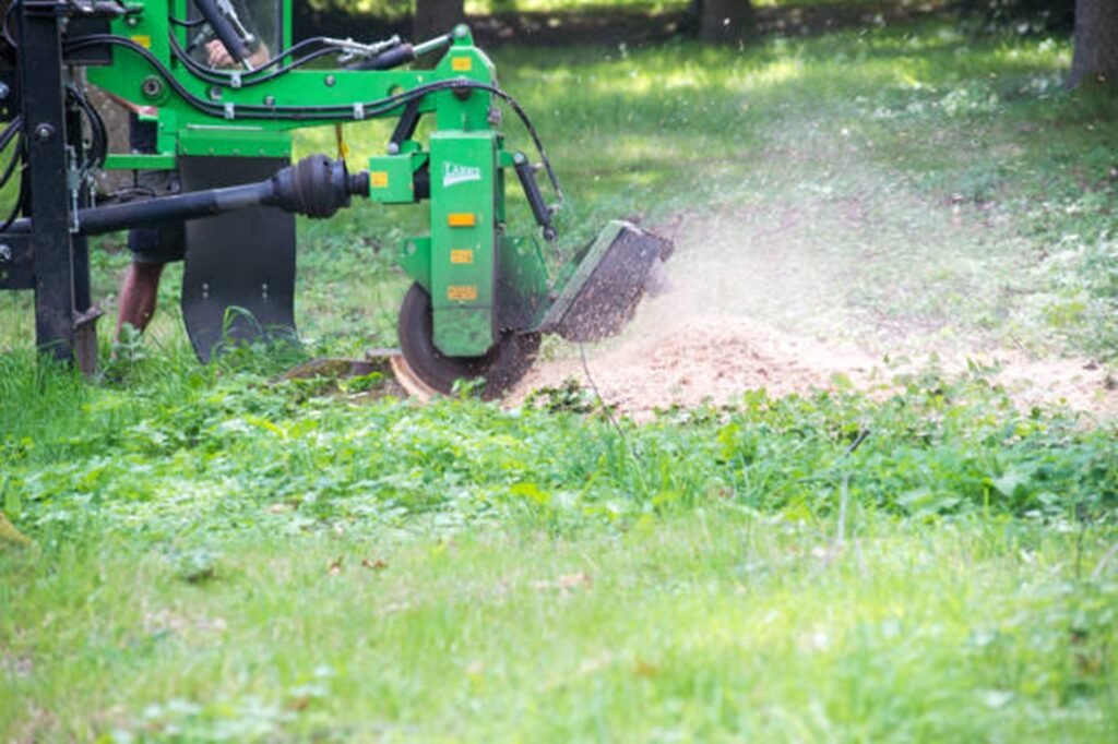 Stump grinding equipment removing a tree stump from a residential yard in North Royalton, OH